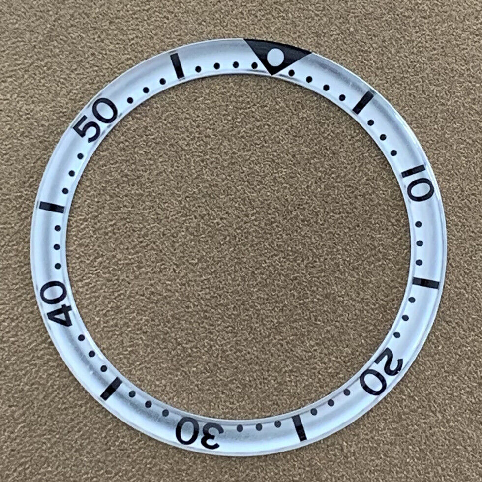 White font 39mm aluminum bezel insert with circular arc bevel for watch customization.