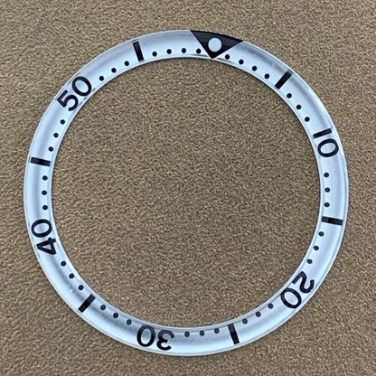 White font 39mm aluminum bezel insert with circular arc bevel for watch customization.