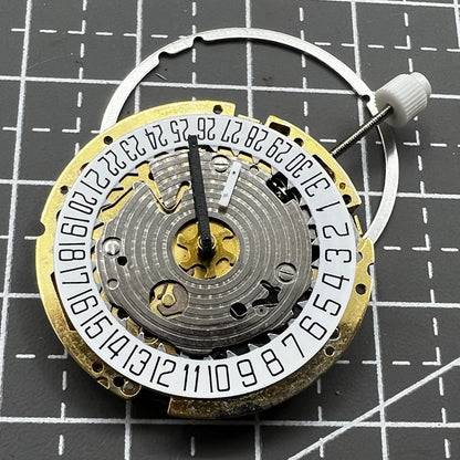 Swiss ISA Quarzuhrwerk 8176-2050 watch movement with small seconds at 2 o'clock and date at 6 o'clock for precision timekeeping.