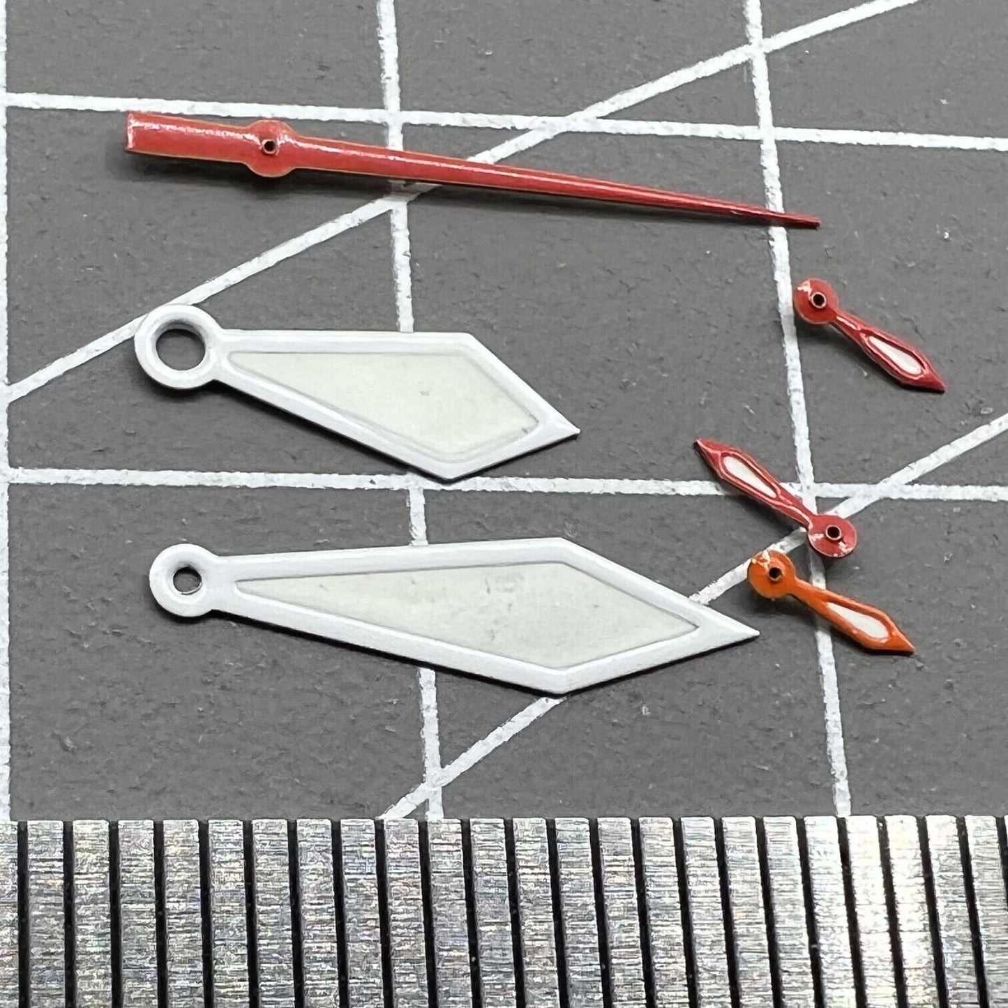 White trimmed green lume watch hands for Miyota OS10 movement, improving readability and design.