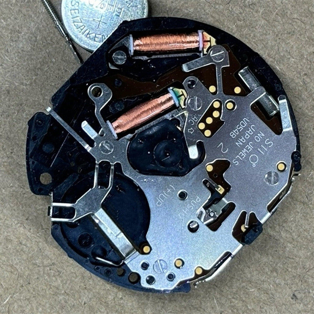 Japan Made VD54B multifunctional quartz watch movement, precise no-calendar repair part for accurate timekeeping.