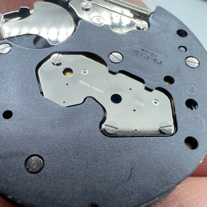 Ronda Z60 Swiss quartz watch movement with small second hand at 6 o'clock, precision craftsmanship for watch repair.