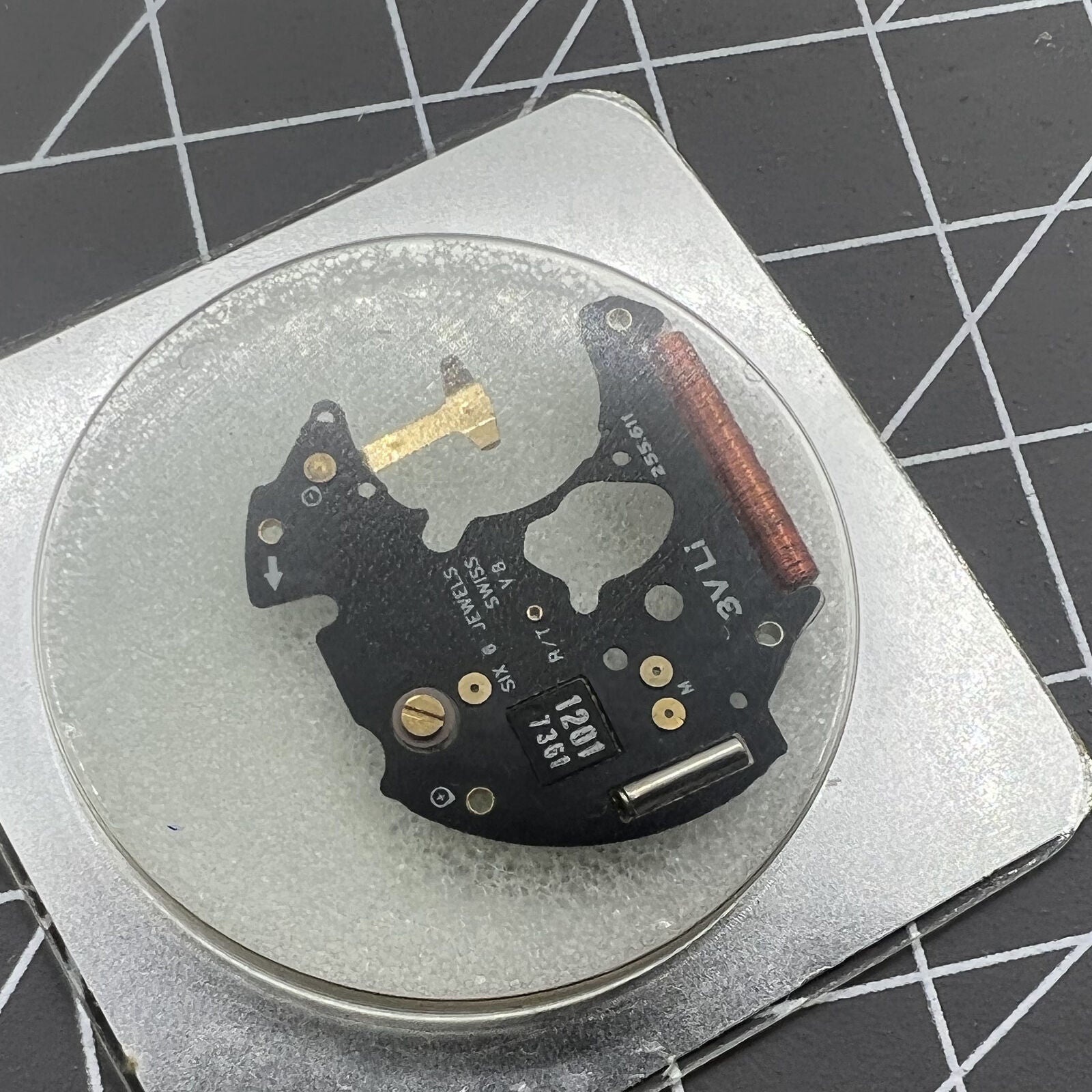 ETA 255.111 watch movement circuit board by ETA, disassembled for precise timekeeping repair.