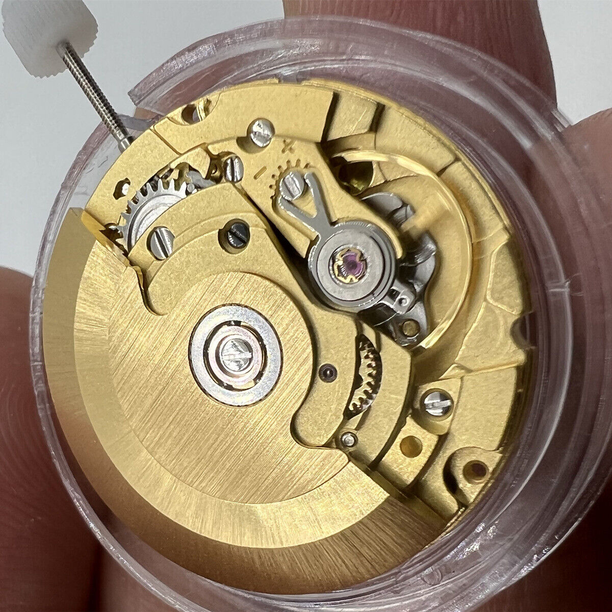 Hangzhou HZ6460 mechanical watch movement showing date window at 3 o'clock, ETA2836 replacement part for precise timekeeping.