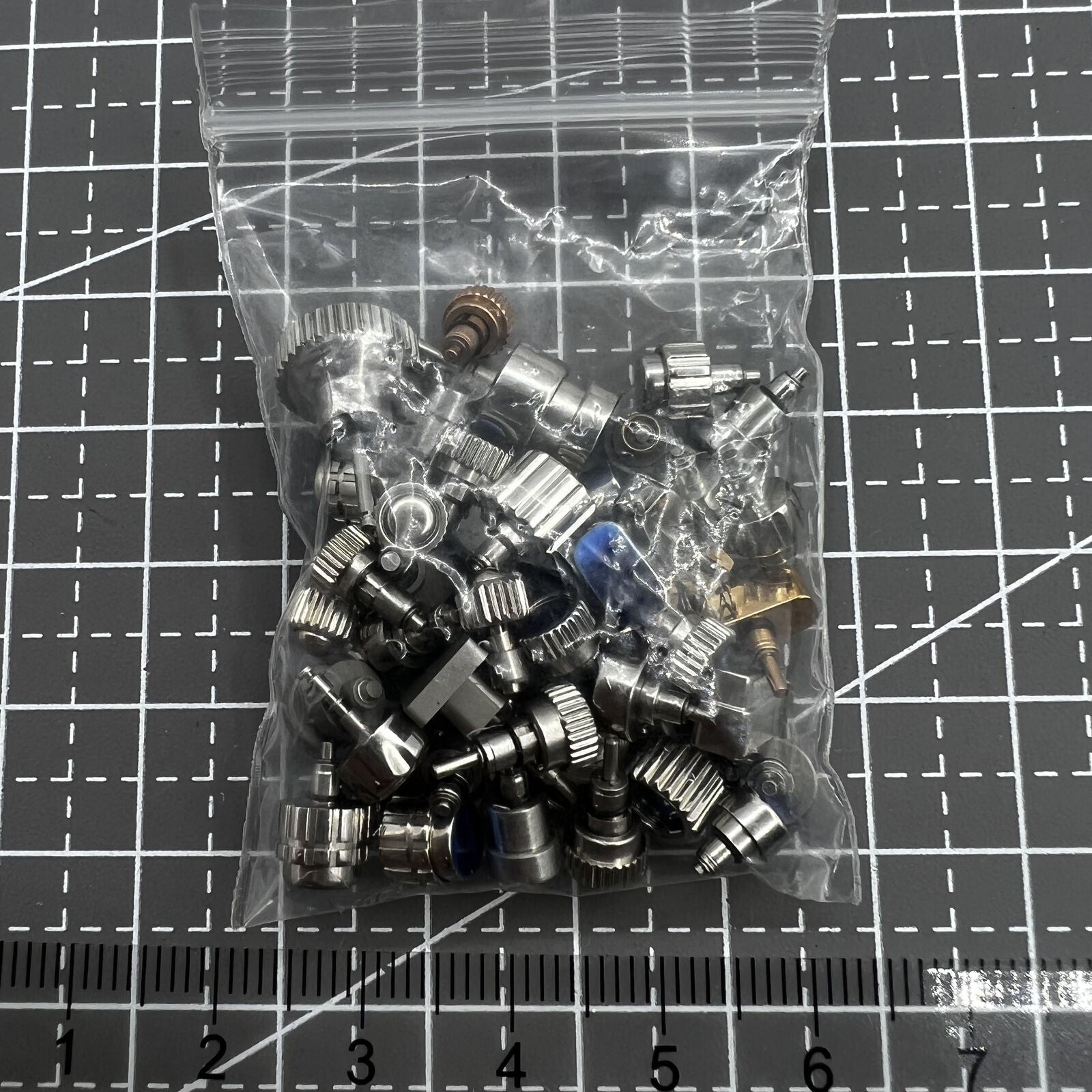 Assorted watch push buttons pack, 50 pieces, perfect for Timex watch repair and replacements.