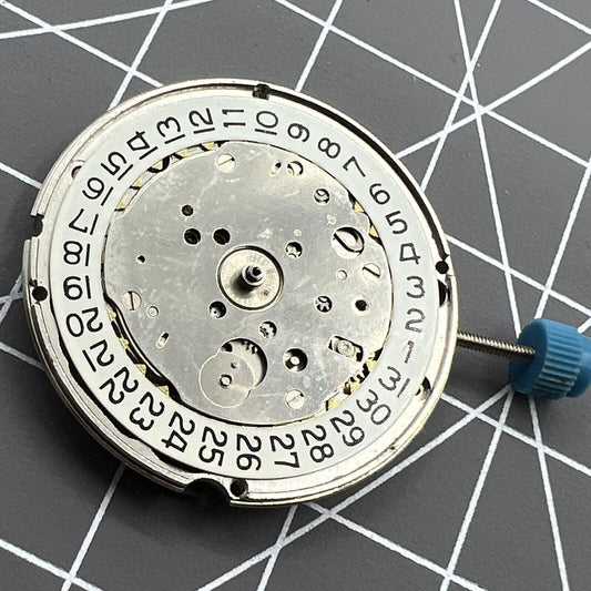 Swiss Made ETA 963.116 quartz watch movement with single calendar at 3 o'clock for precise timekeeping.
