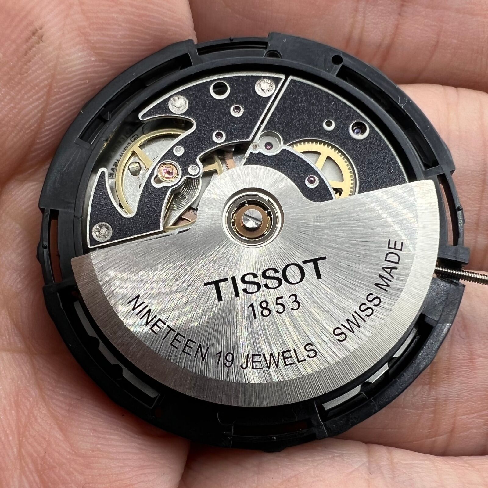 ETA C15.111 chronograph mechanical watch movement with white dial, Swiss precision by Tissot.