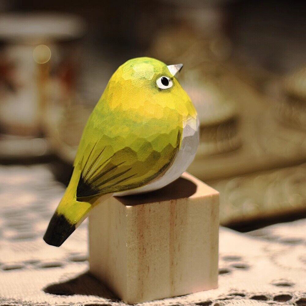 Handmade white-eye bird wooden figurine, charming decorative artwork for home or office.