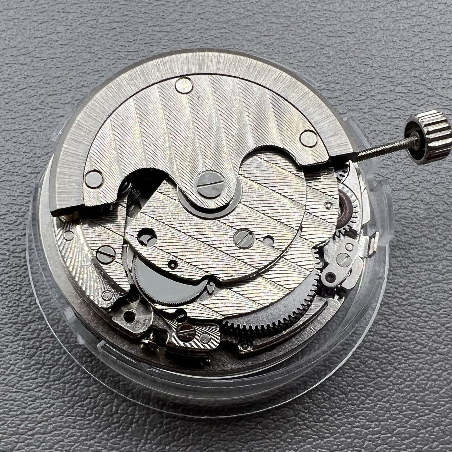 Tianjin ST17 T17 hand-wound watch movement with two hands and power reserve indicator at 10 o'clock.
