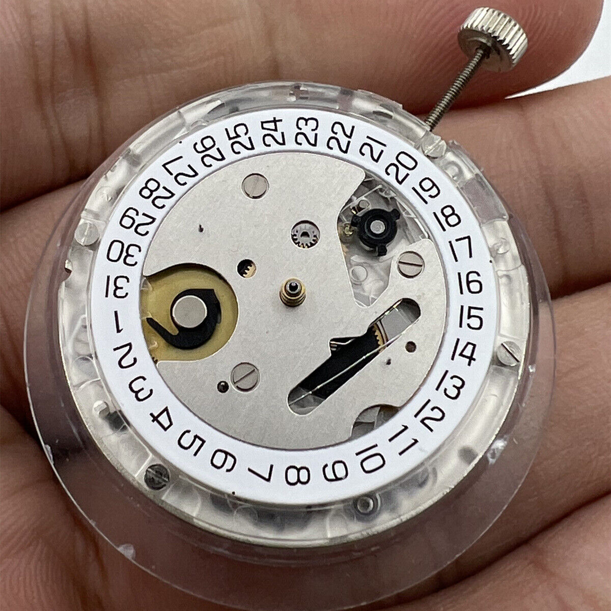 Swiss Made ETA C01.211 chronograph watch movement with white dial by 1853, precise mechanical design.