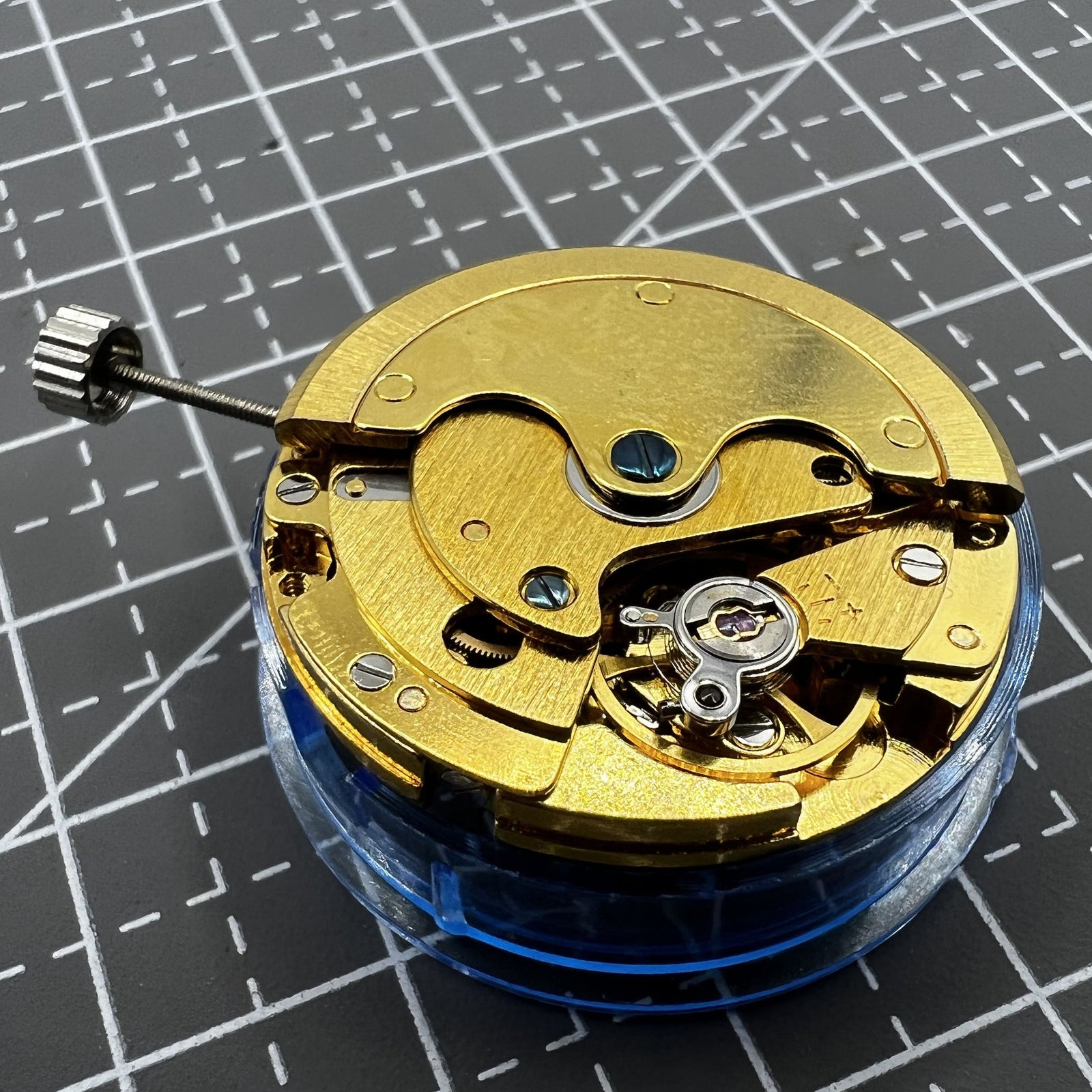 Polished gold Tianjin T16 mechanical watch movement, compatible with Miyota 8200, precision replacement part.
