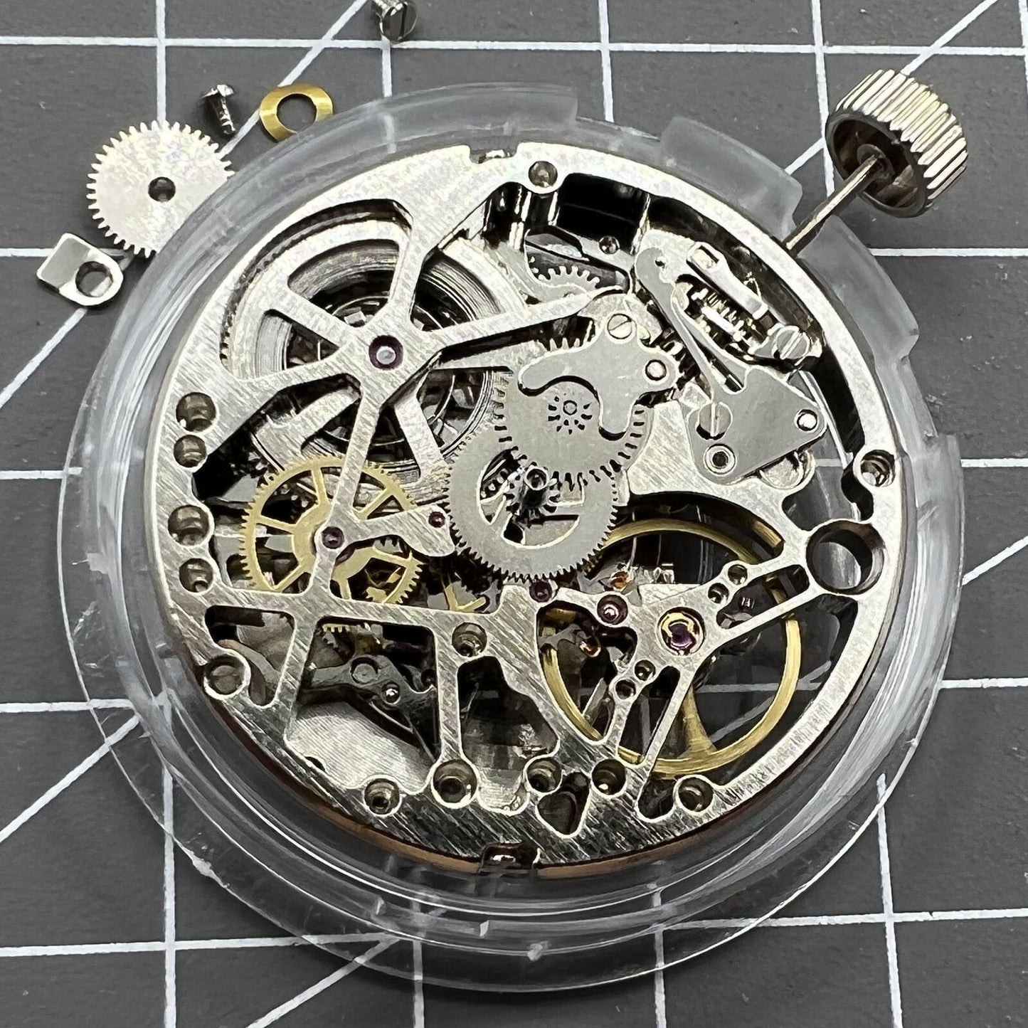 Tianjin Seagull ST25 silver watch movement showing automatic mechanical 3 hands with hollow design.