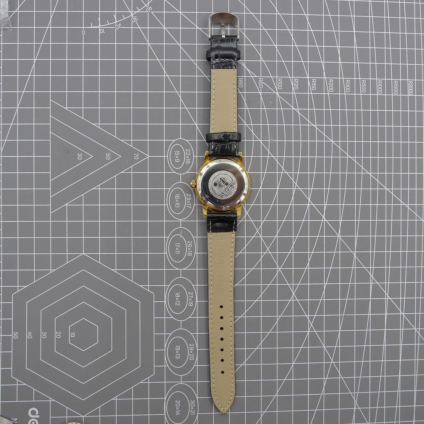 Beijing Double Rhomb watch with golden case, silver nail markers, manual mechanical movement, classic style timepiece.