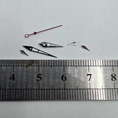 Green luminous watch hands with silver trim for ISA 9238 quartz movement, ensuring precision and durability.