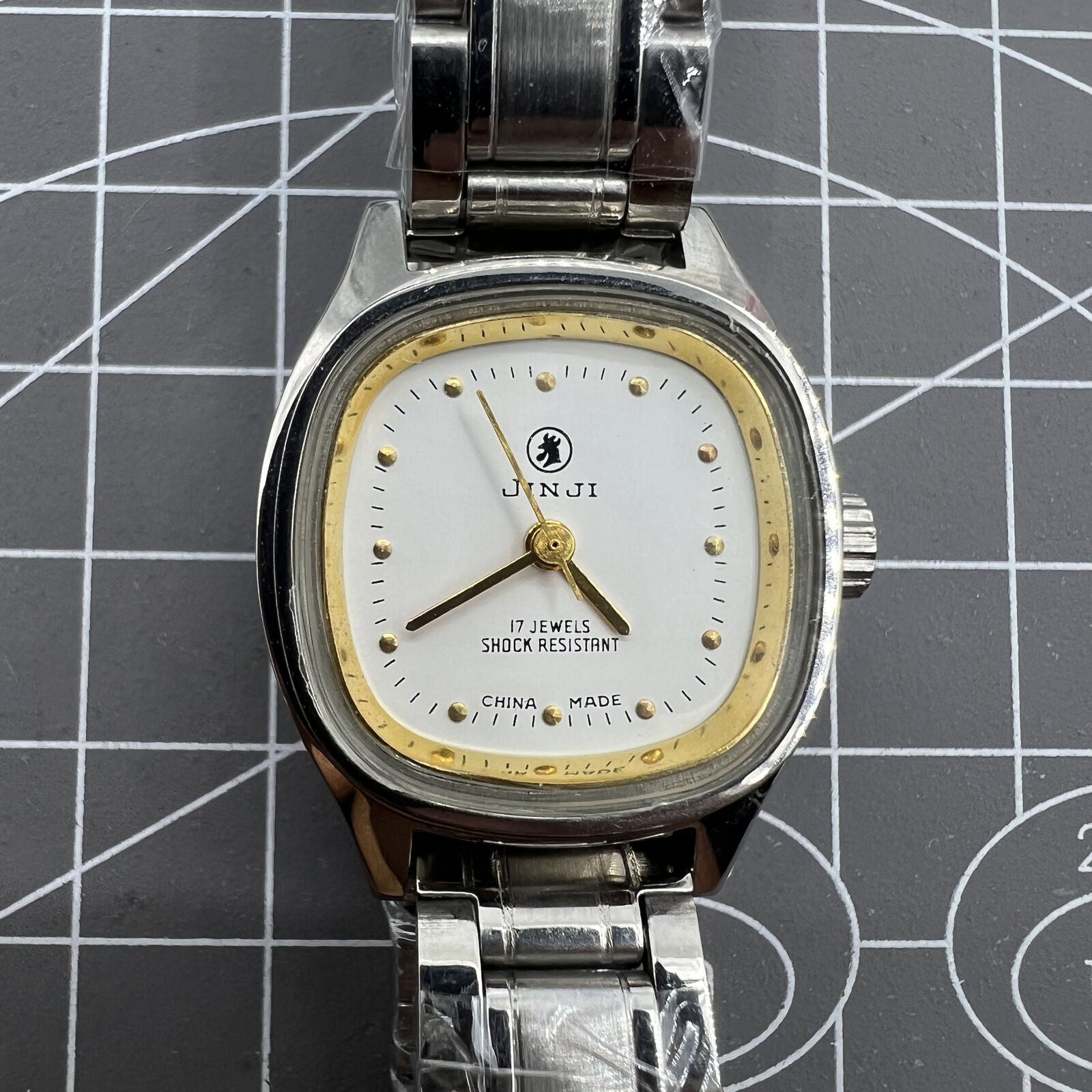 SHANGHAI JINJI 26mm lady watch with golden square case, manual mechanical movement, and elegant 17-jewel design.