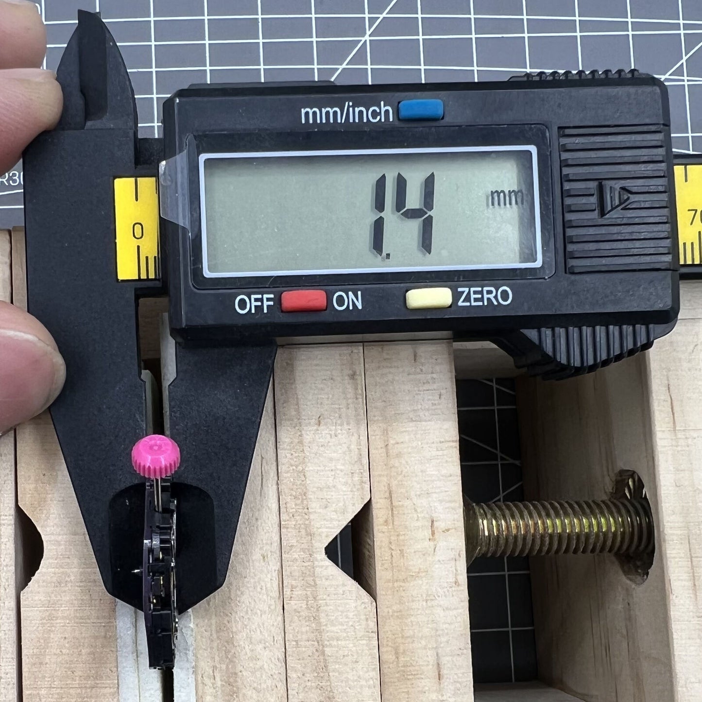 Citizen Eco-Drive E168M quartz watch movement with three hands and date window at 3 o'clock for precise timekeeping.