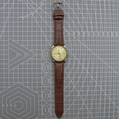 37mm Dandong Peacock manual watch with 33 jewels, golden dial, and single calendar display.