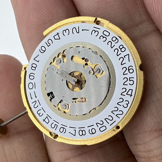 Ronda 6004D quartz watch movement with date at 3, Swiss made for precise timekeeping.