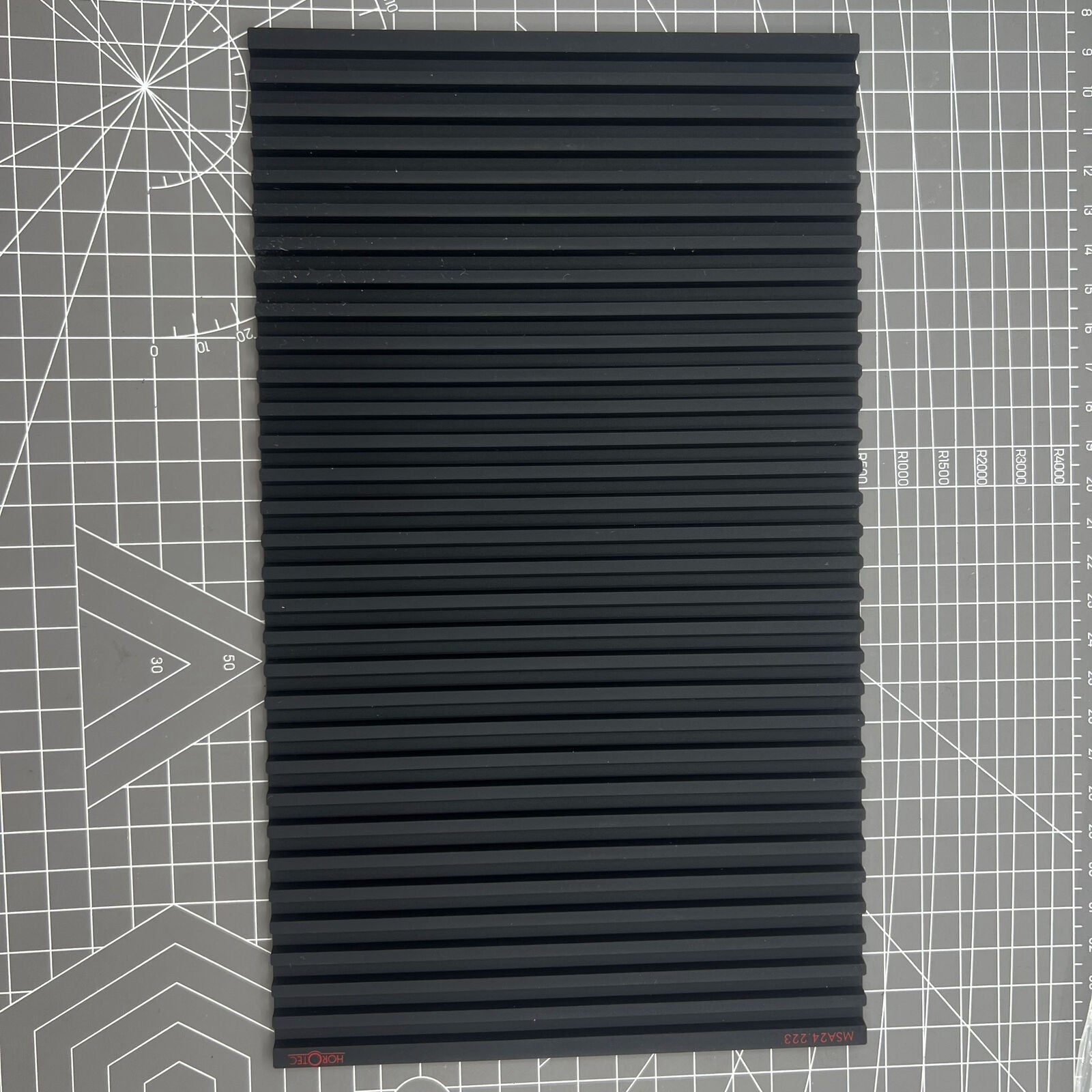 Swiss Horotec MSA24.223 black silicon bench mat with 32 grooves for secure watch accessory handling