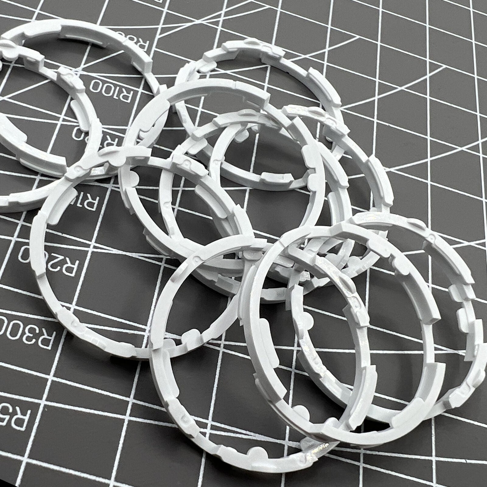 Set of 5 Miyota 8200 series movement cushion spacer rings for precise watch assembly.