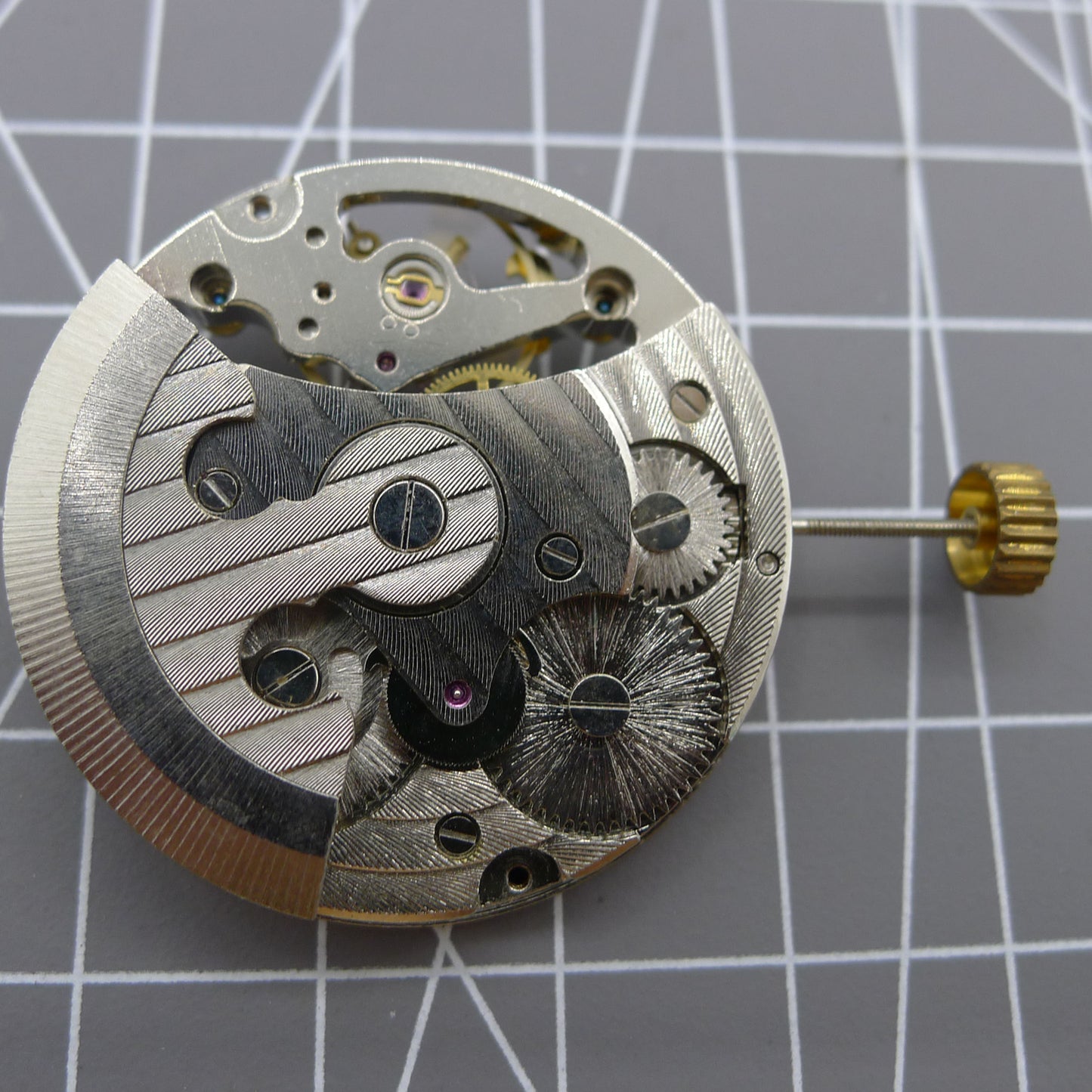 Automatic mechanical watch with silver 3 hands and hollow moon phase display at 12 o'clock.