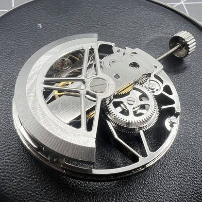 Dandong 8306 silver watch featuring hollow dial and 2-hand automatic movement, elegant mechanical design.