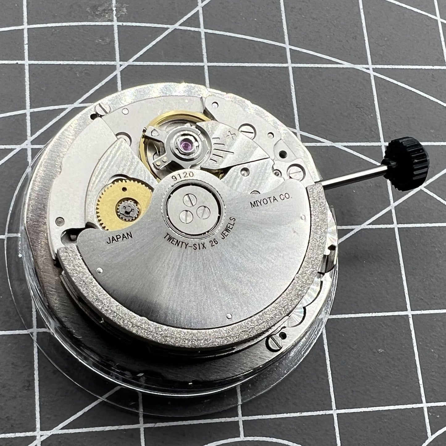 Miyota 9120 automatic watch movement with date display at 4:30, enhancing accurate timekeeping.