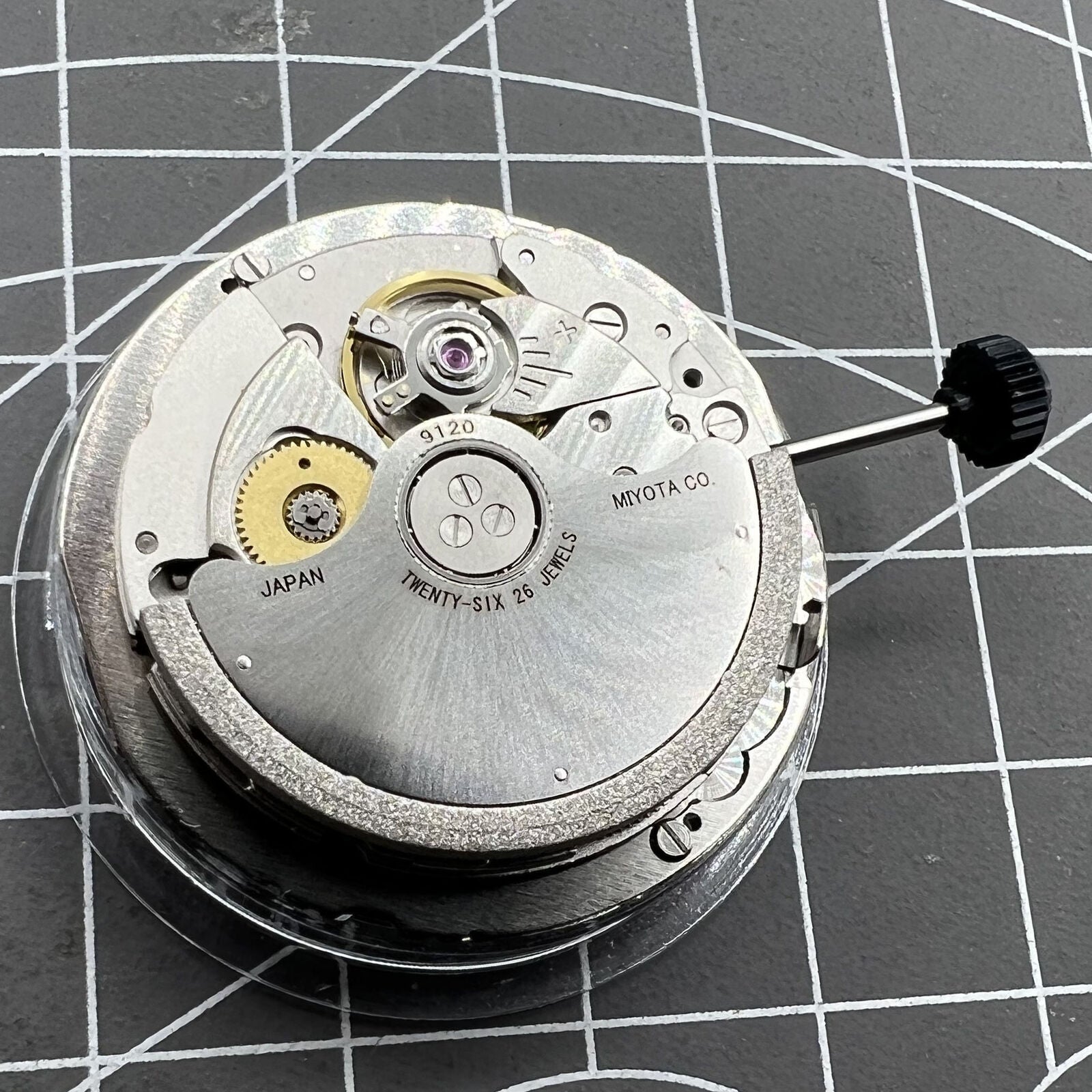 Miyota 9120 automatic watch movement with date display at 4:30, enhancing accurate timekeeping.