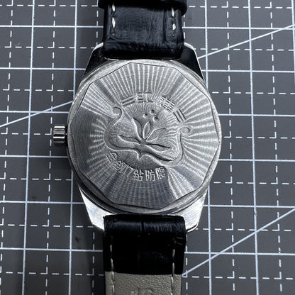 Taihang 32mm manual mechanical watch with black strap, golden markers, and black dial for classic elegance.