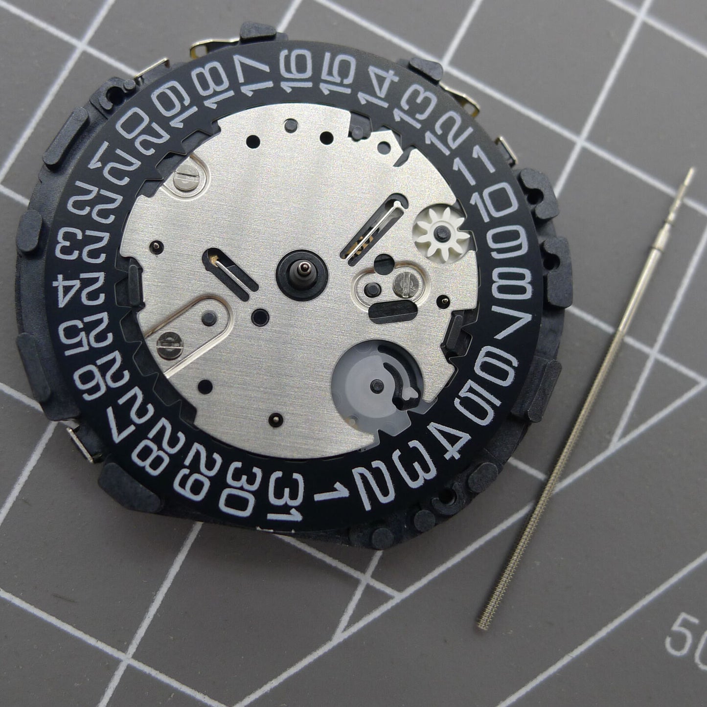 Japan Made VR32B quartz watch movement with multifunctional features and black dial for precision timekeeping.