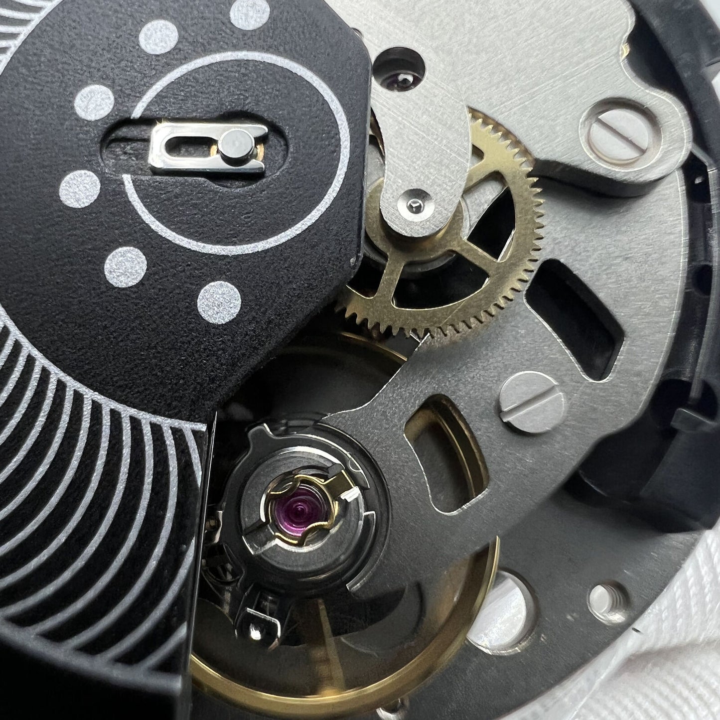 Swiss Made ETA C01.211 chronograph watch movement with black dial by 1853 brand, precise mechanical accessory.