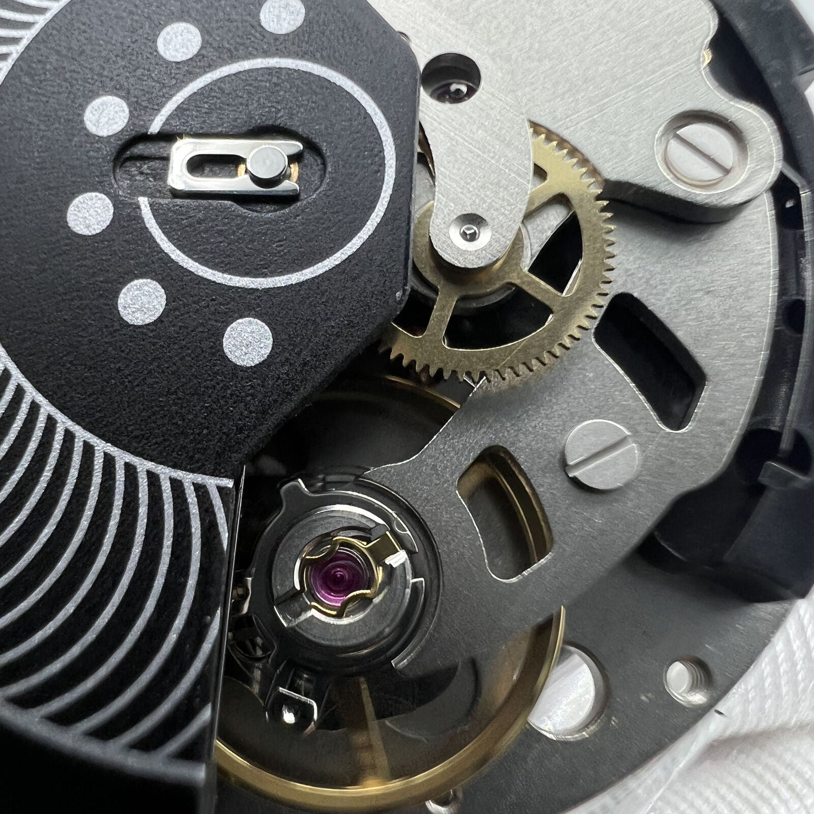 Swiss Made ETA C01.211 chronograph watch movement with black dial by 1853 brand, precise mechanical accessory.