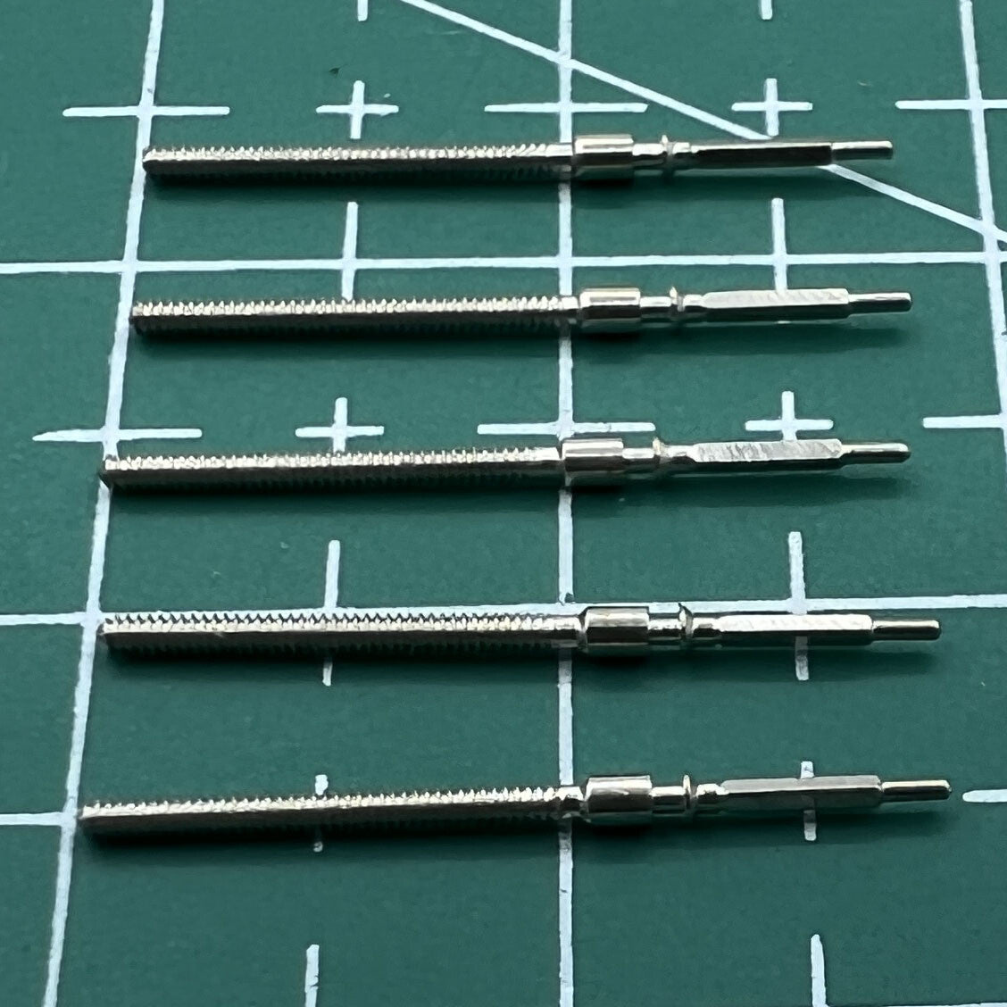 Wholesale lot of durable watch winding stems for 6309 movement, ideal for Seiko watch repairs.