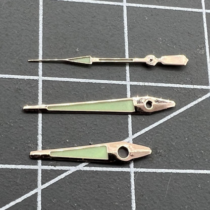 Rose Golden 14mm arrow-shaped luminous watch hands by ISA, enhancing green glow and precise time reading.