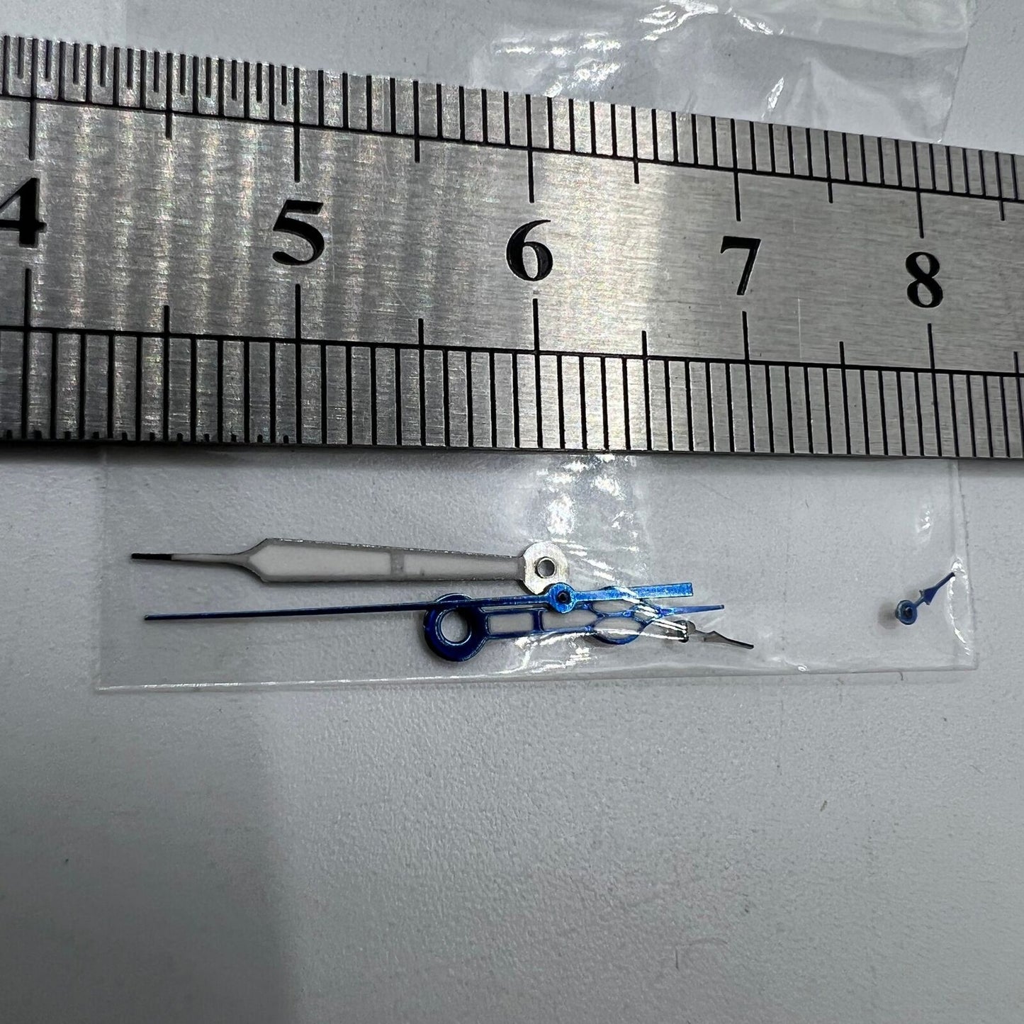 Miyota OS10 green lume watch hands with blue trim, designed for precise fit and improved visibility.