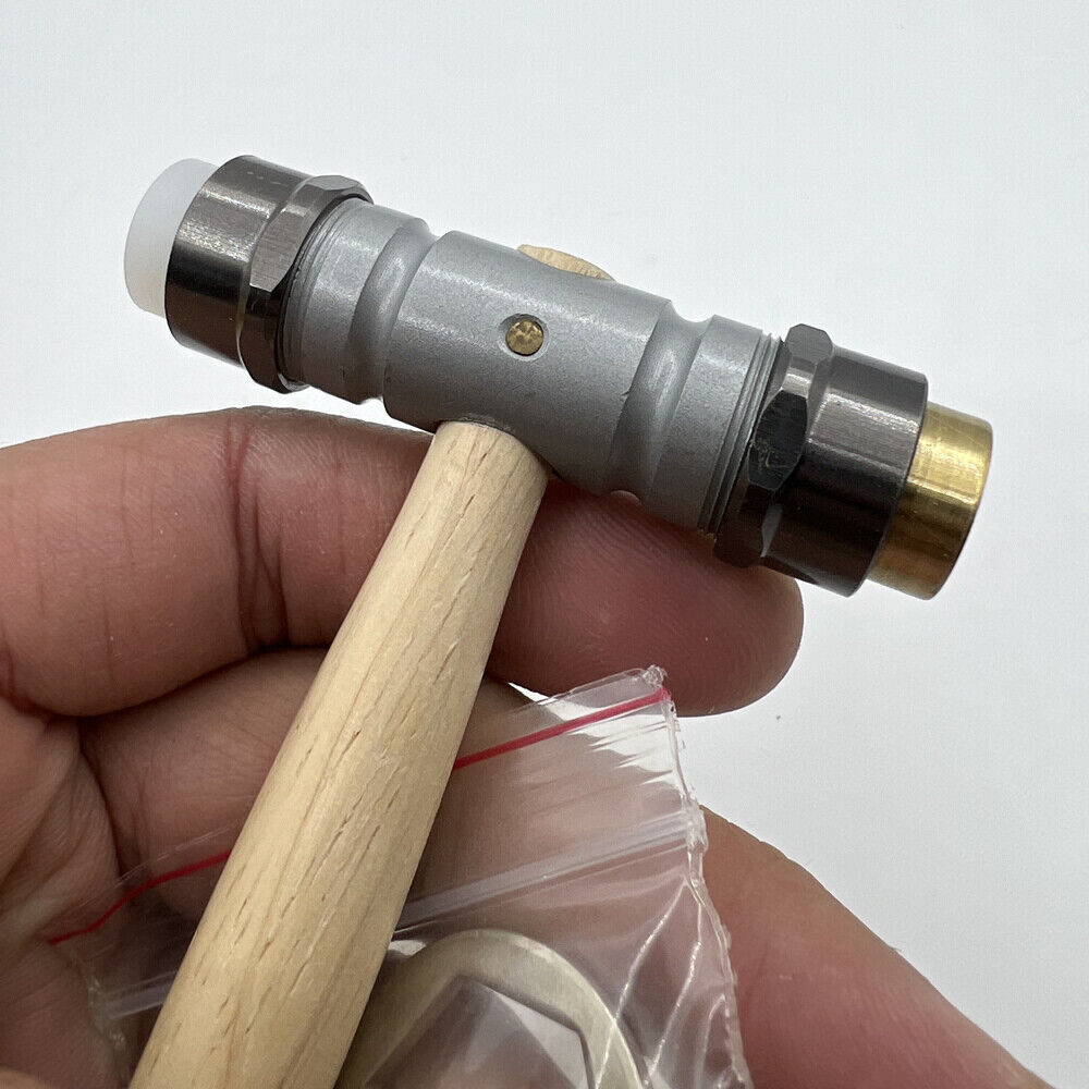 Bergeon 30417 watchmaker hammer with brass and synthetic ends for delicate watch repairs.