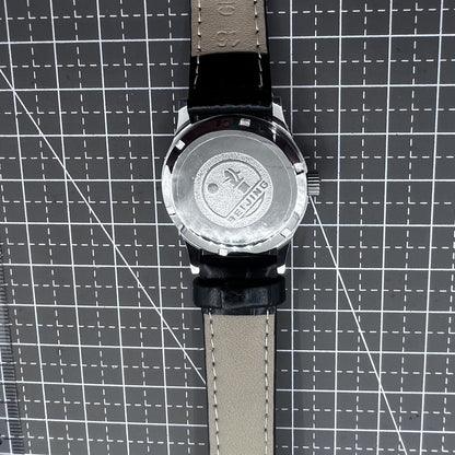 Beijing 31mm mechanical watch with black double rhomb strap, silver case, and classic three-hand design for elegant style.