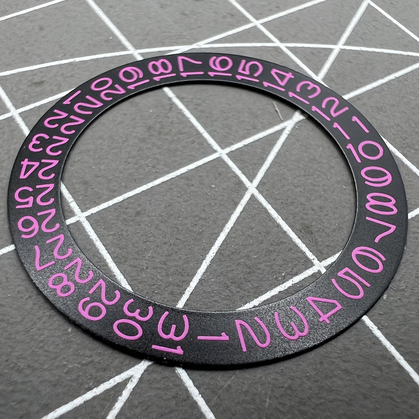 Pink character date disk overlay on black background for NH35 NH36 watches, enhancing dial readability.