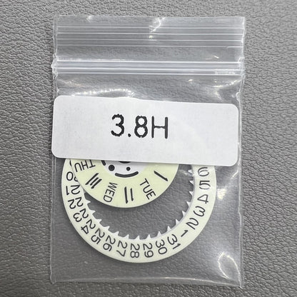 White date and week disk wheels with green lume, compatible with Seiko NH36 movement for watch customization.