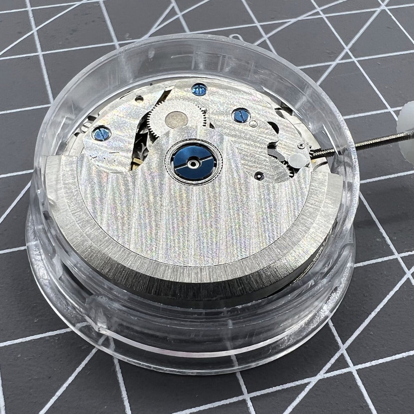 ST10 automatic mechanical watch accessory, date at 3 o'clock, small seconds at 6, 9, and 12 markers.