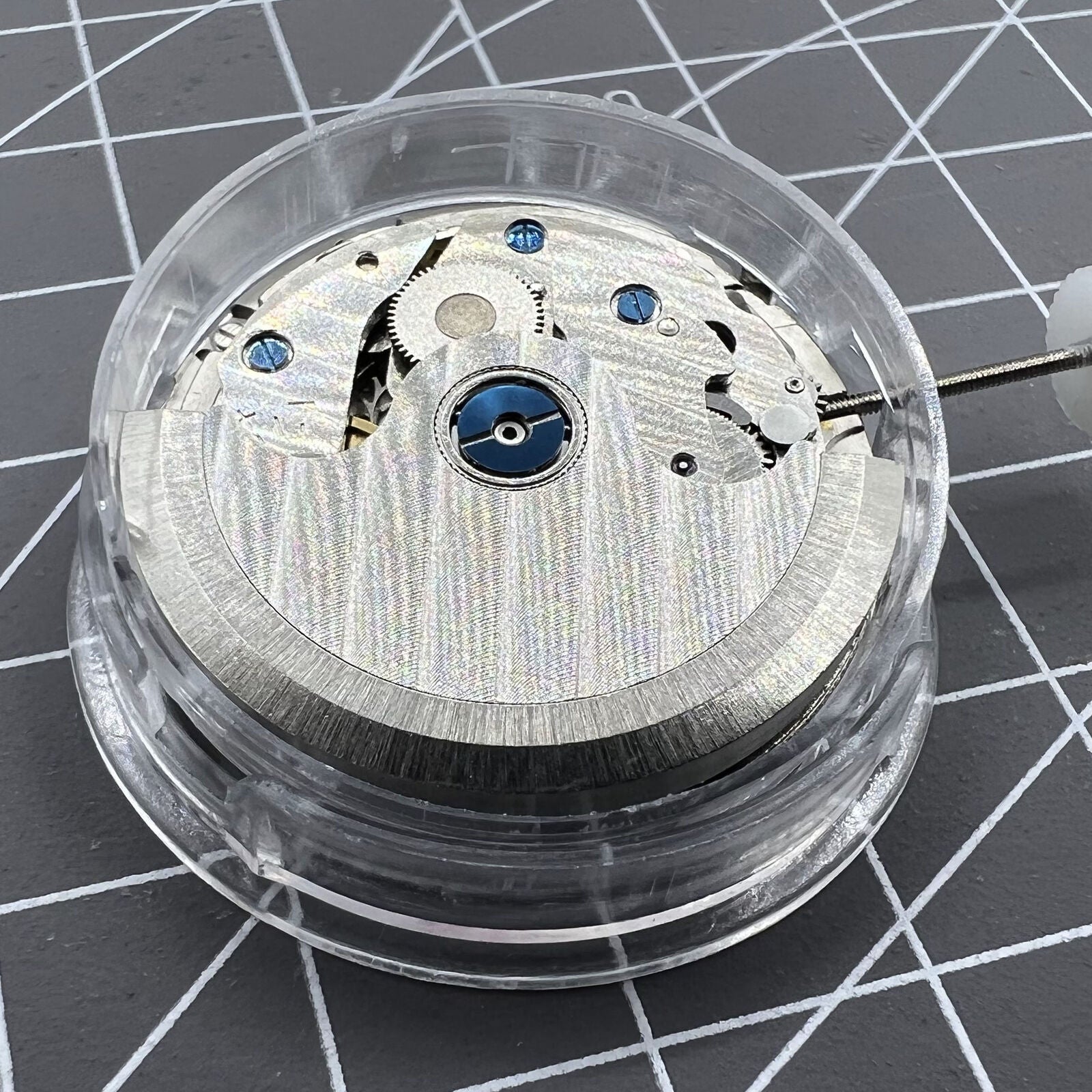 ST10 automatic mechanical watch accessory, date at 3 o'clock, small seconds at 6, 9, and 12 markers.