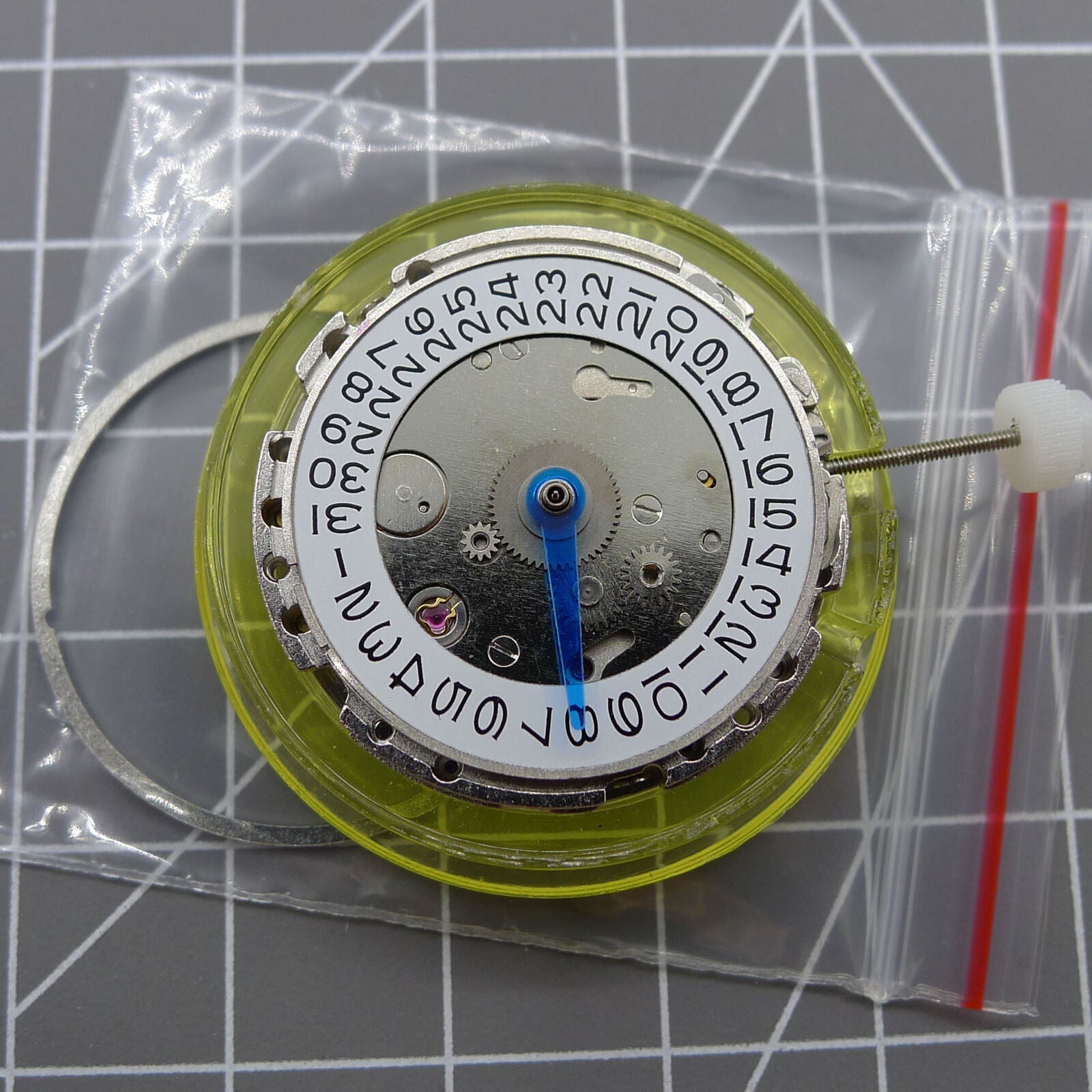 DG2813 automatic mechanical watch movement with silver 4-hand design and adjustable 24-hour GMT hand.