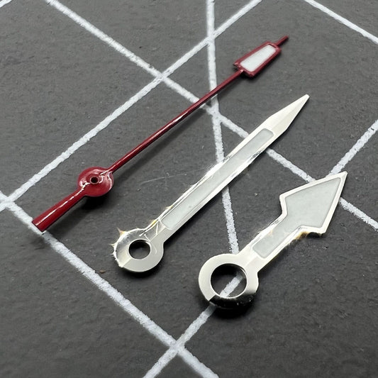Silver arrow-shaped watch hands with red second hand and green lume, compatible with NH35 NH36.