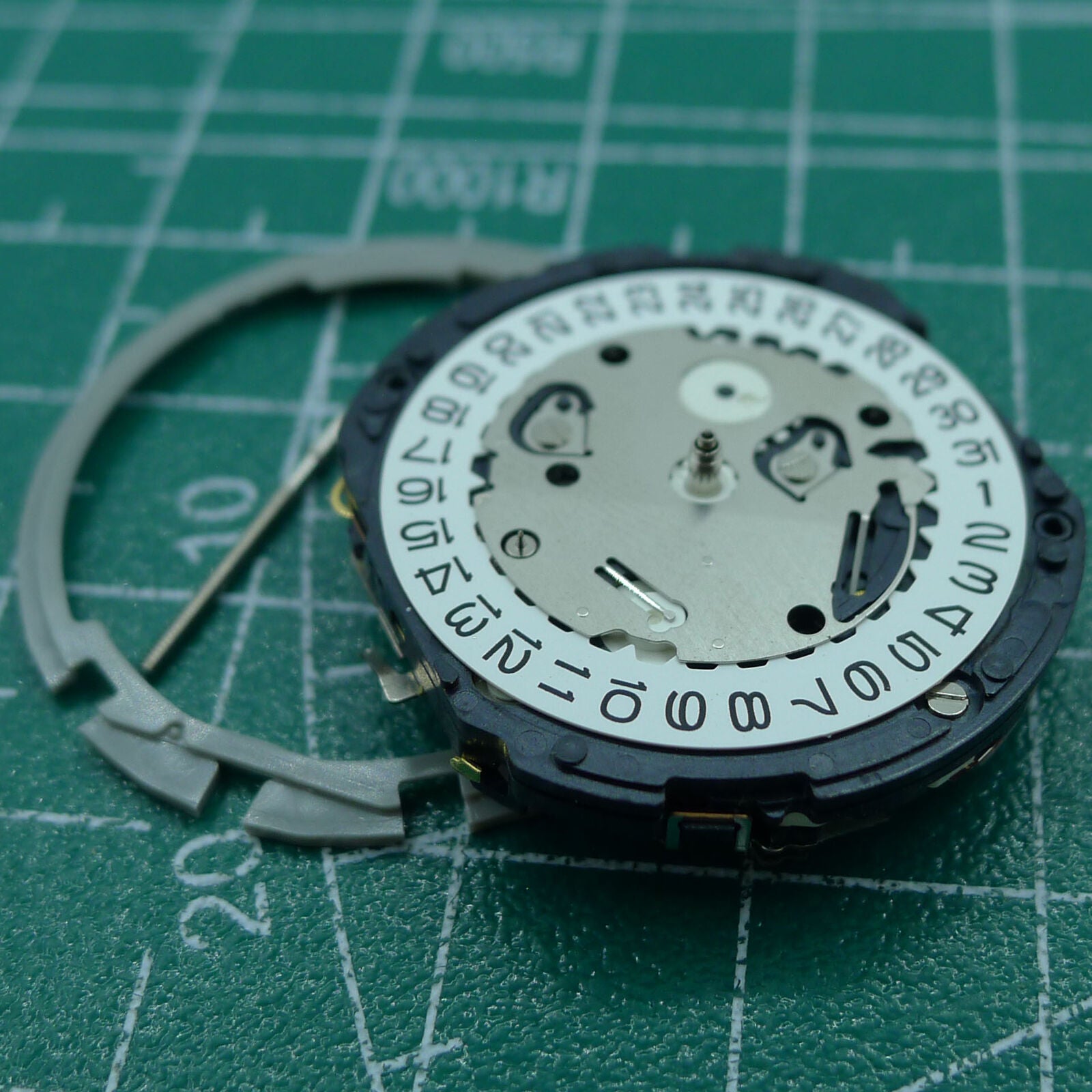 Hattori Epson TMI YM12 quartz watch movement, Japan-made, precise timekeeping for repair enthusiasts.