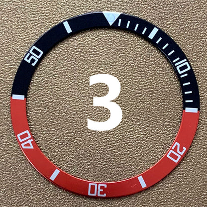 Red, blue, and black aluminum bezel insert for 39mm/32mm watch, enhancing style and durability.