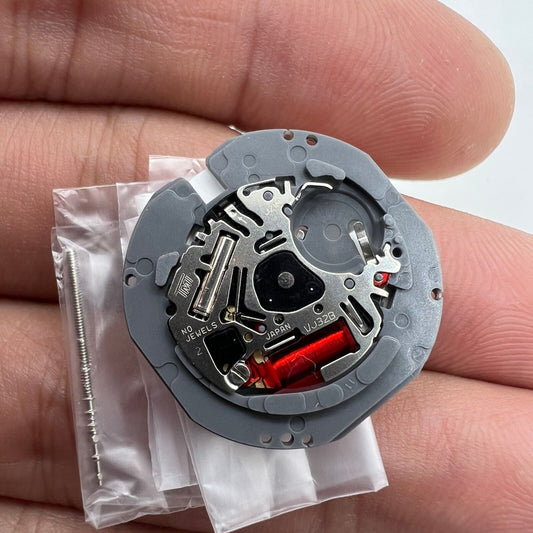 Hattori Epson TMI VJ32 quartz watch movement with date display at 3/6, Japan-made precision mechanism