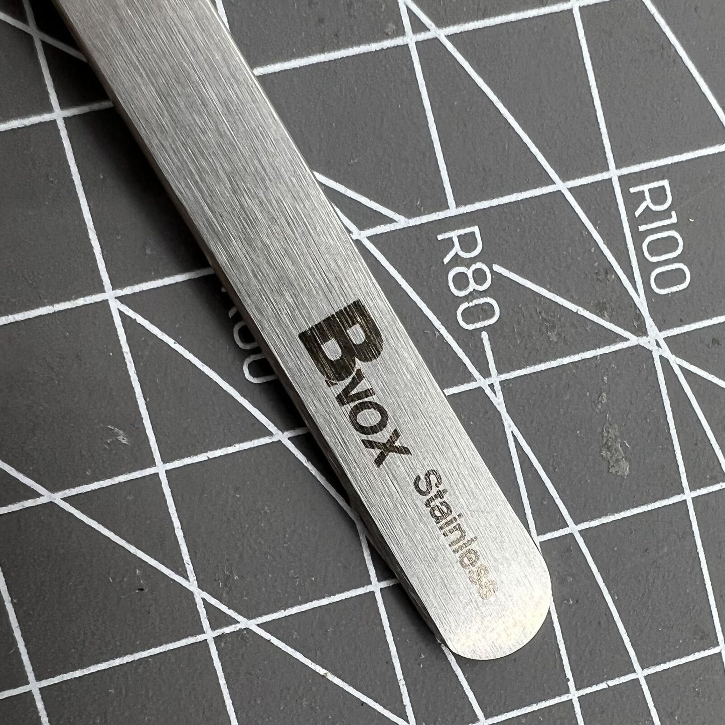 Bergeon 7027-SS stainless steel tweezers with fine tips for precise Swiss watch repair tasks.