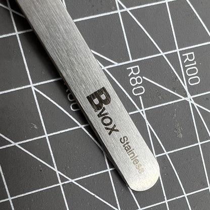 Bergeon 7027-SS stainless steel tweezers with fine tips for precise Swiss watch repair tasks.