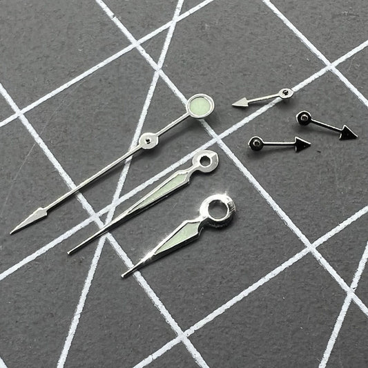 Silver trim green luminous pointed watch hands for Miyota OS series, improving visibility and elegance.