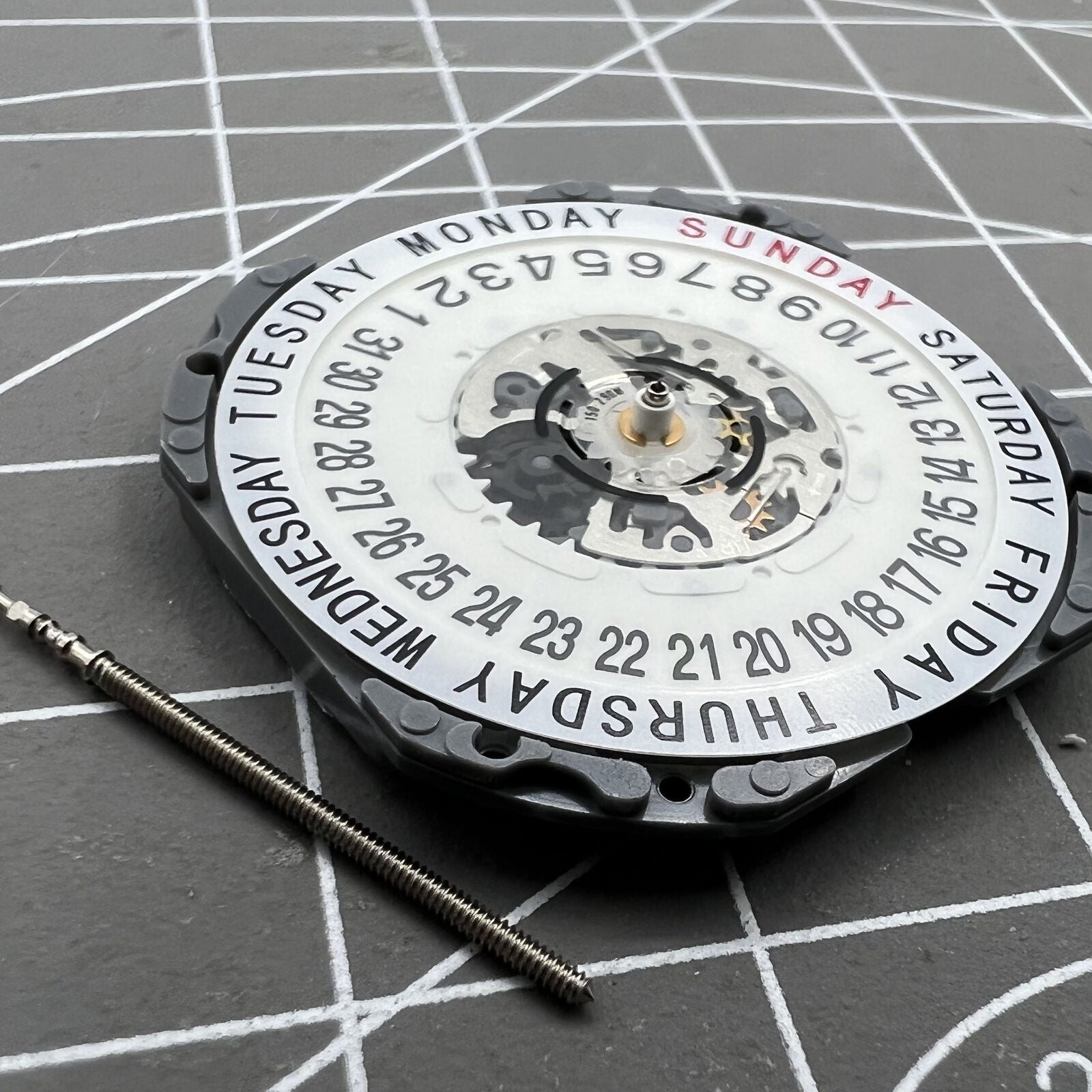 Hattori Epson TMI VJ55 quartz watch movement with date at 6, precision Japan-made component.